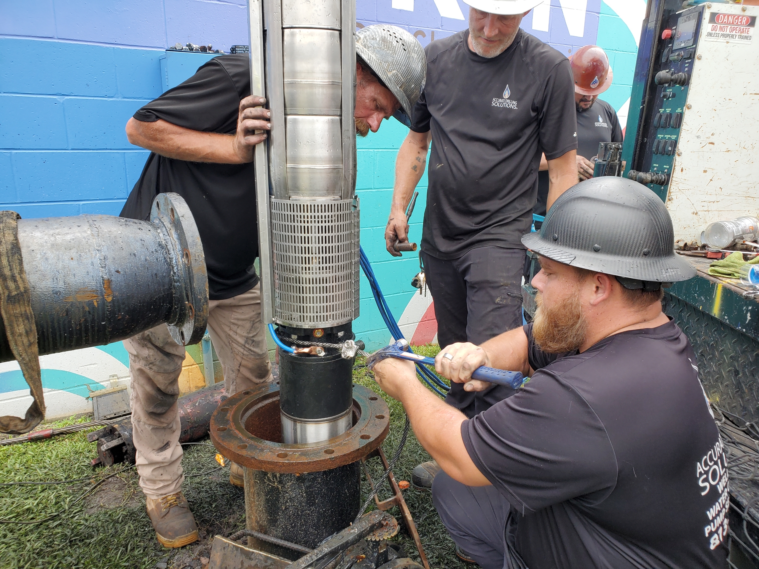 Homeowner reviewing irrigation well checklist Auburndale property before fall dry season