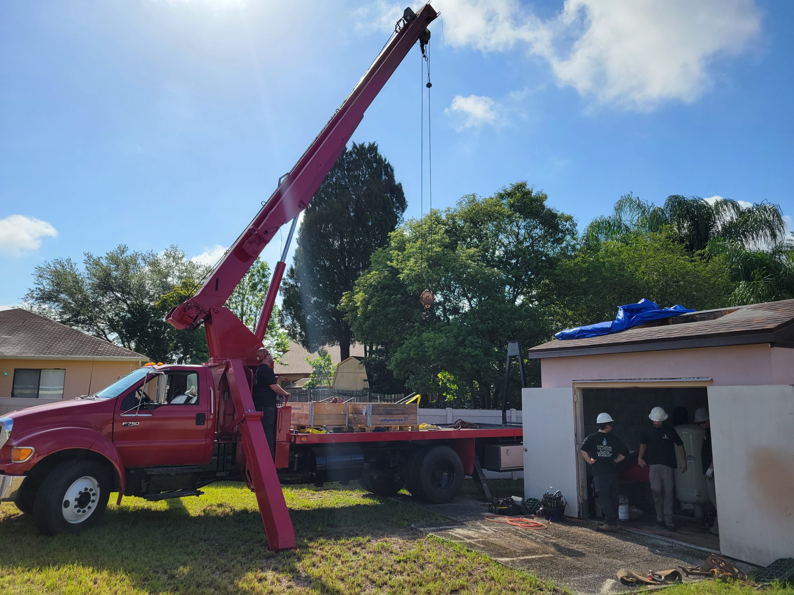 Technician inspecting well casing before well pump installation Tampa residential property