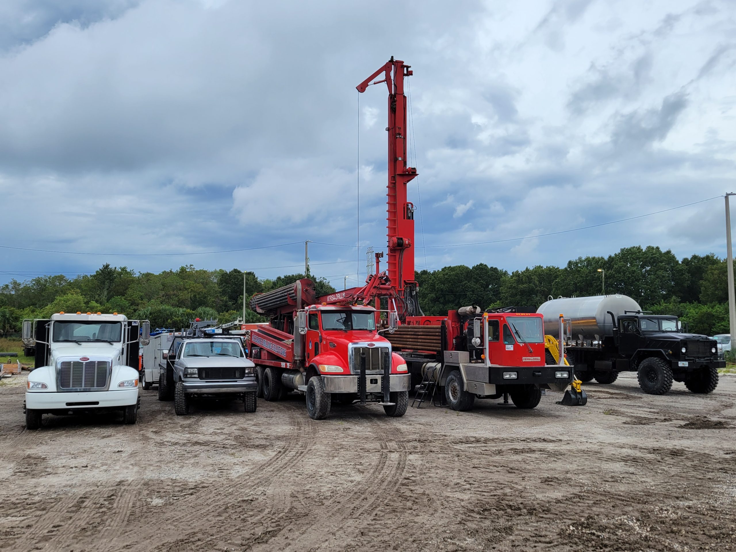 Drilling rig and equipment on a residential lot for water well drilling Spring Hill
